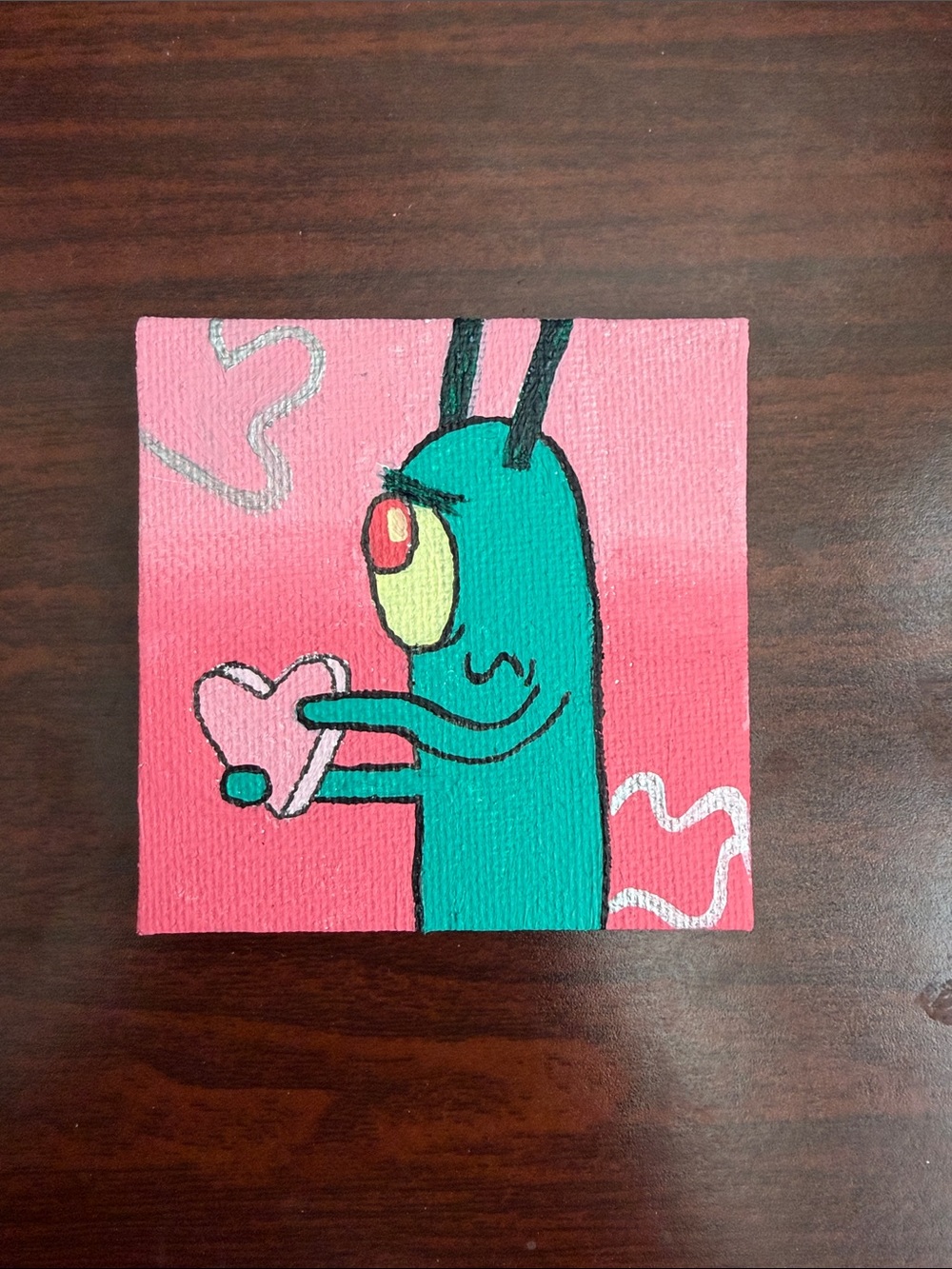 Turquoise Cartoon Character Wall Art on Pink Background